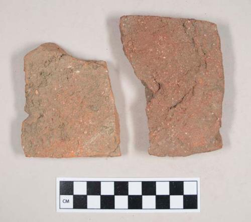 Redware roof tile fragments, one with nail hole