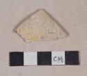 Unglazed, undecorated, buff bodied refined earthenware body sherd