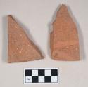 Redware roof tile fragments, one with nail hole