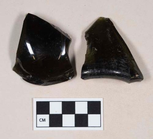 Olive green bottle glass base fragments, one with embossing; two fragments crossmend