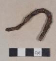 Cut or wrought bent iron fragment