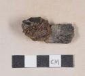 Unidentified iron adhered to coal fragments