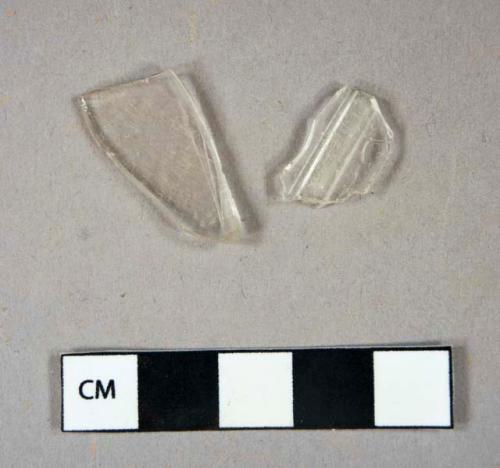 Glass, curved, clear, one molded, fragments