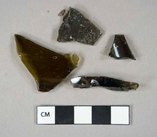 Glass, curved, bottle, olive green fragments