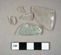 Glass, curved, 9 clear, 2 aqua, and 1 green fragment