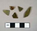 Glass, curved, olive green, fragments