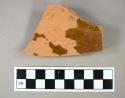 Ceramic, earthenware, redware, brown lead glaze, base sherd