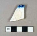 Ceramic, earthenware, pearlware, blue and white feather edge, rim sherd