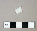 Glass, flat milk glass fragment