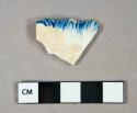 Ceramic, refined earthenware, blue rococo edged pearlware rim sherd