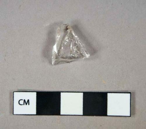 Fragment of clear bottle glass