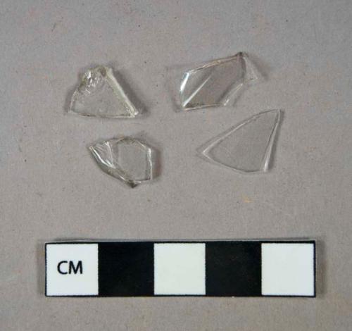 Glass, clear, curved, fragments