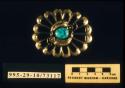 Sandcast belt buckle in floral motif set with turquoise