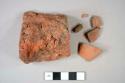 Brick fragments, including ceramic, earthenware, brown glazed redware body sherd