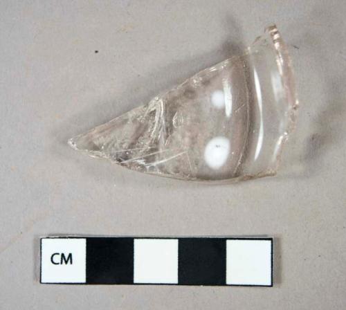 Glass, colorless mold-blown bottle base fragment