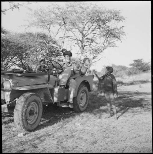 Children riding in the expedition Jeep with Heiner Kretzchmar