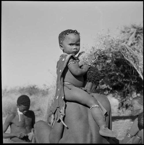 Gau of Band 2 carrying his son, /Qui, on his shoulders