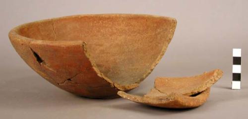 Reddish sand-tempered pottery bowl (restored)