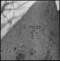"I[?]. Berger 8.4.33" carved in the trunk of a baobab tree, close-up