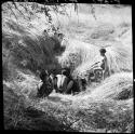 Man and two boys at a waterhole