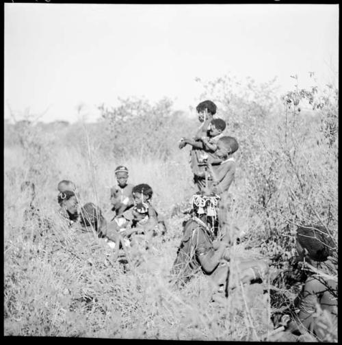 Group of women and girls digging for roots