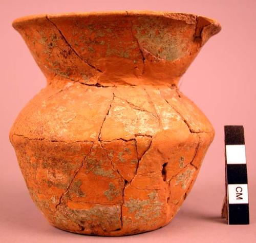 Vase of very thin yellow ware, coated with thin plaster and painted green