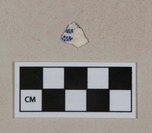 Blue on white transferprinted whiteware vessel body fragment, white paste