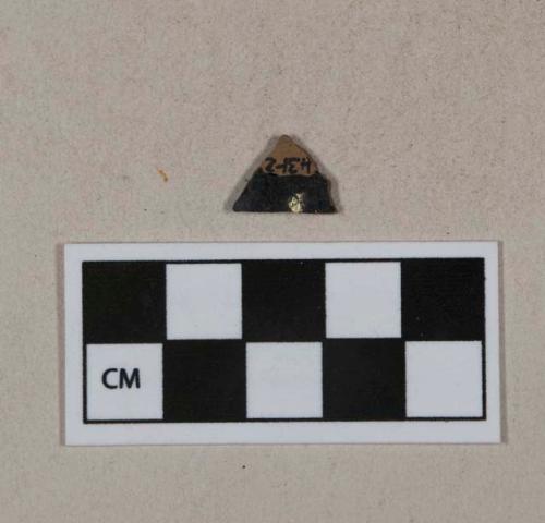 Lustrous black lead glazed redware vessel body fragment, likely jackfield type