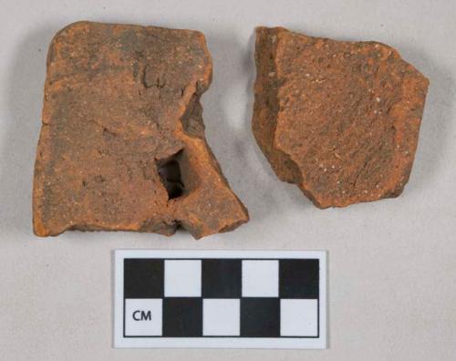 Red ceramic rooftile fragments, 1 with nail hole