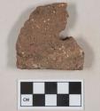 Red ceramic roof tile fragment, visible temper, partial nail hole