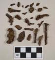 Ferrous metal fragments, 7 likely nail fragments, all heavily corroded