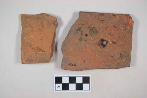 Red ceramic rooftile fragments, 1 with nail hole