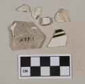 White pearlware vessel body and rim fragments, white paste, 1 fragment with black machine-turned decoration