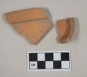 Undecorated, unglazed redware vessel base and rim fragments, likely terracotta flower pot fragments