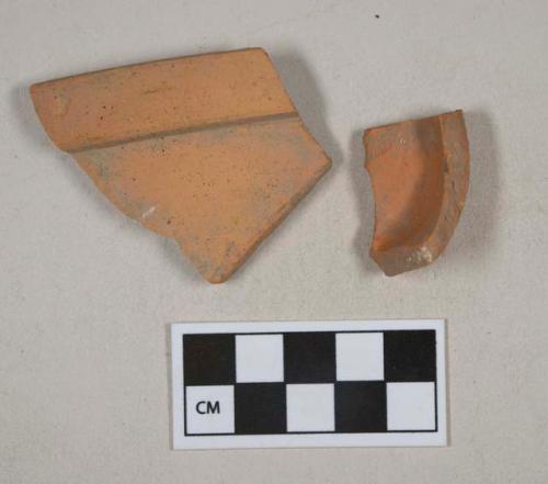 Undecorated, unglazed redware vessel base and rim fragments, likely terracotta flower pot fragments