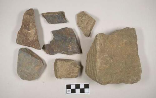 Gray stone fragments, likely architectural