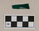 Green and white glass fragment, likely library style shade