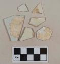 White undecorated pearlware vessel body and rim fragments, white paste