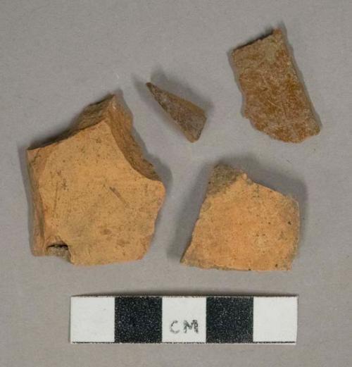 Redware vessel body fragments, 2 with brown lead glaze