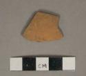 Undecorated unglazed redware vessel body fragment