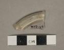 Colorless glass vessel fragment, rolled edge