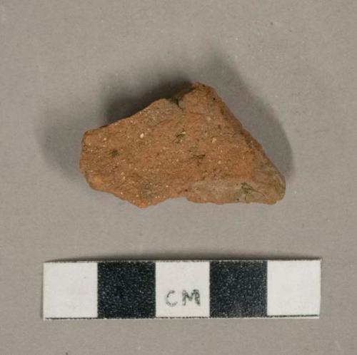 Red ceramic roof tile fragment, visible temper