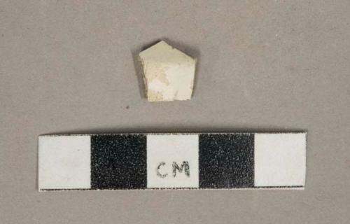 Undecorated whiteware vessel body fragment, white paste