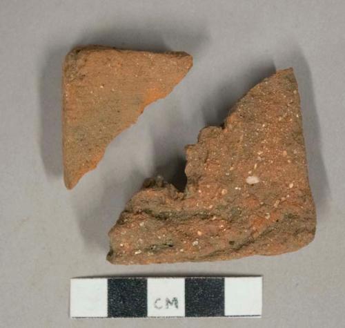 Red ceramic roof tile fragments, 1 with nail hole