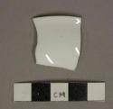 White undecorated porcelain vessel rim fragment, rim unglazed