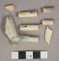 White undecorated kaolin pipe stem and bowl fragments, 2 bowl fragments, 1 burned partial pipe, 4 stem fragments, 3 stems with 4/64" bore diameter, 1 stem with 5/64" bore diameter, 1 stem with 6/64" bore diameter