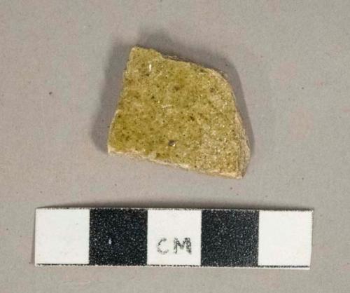 Greenish brown salt-glazed stoneware vessel body fragment, gray paste