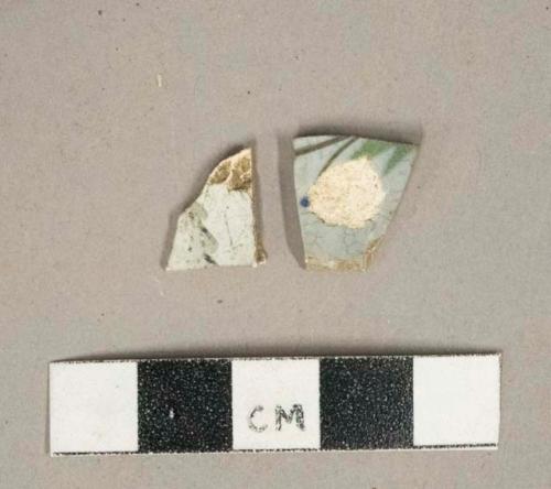 Polychrome handpainted whiteware vessel body fragments, white paste, likely burned