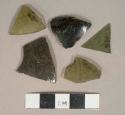 Olive green glass vessel fragments, weathered