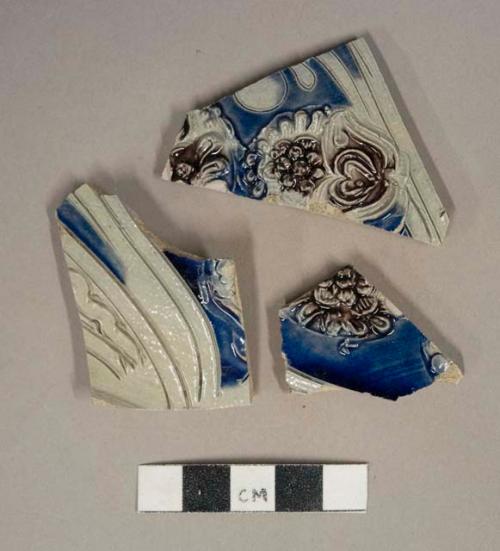 Gray salt glazed stoneware vessel body fragments, cobalt and manganese decorated, molded and incised decoration, gray paste, likely westerwald type